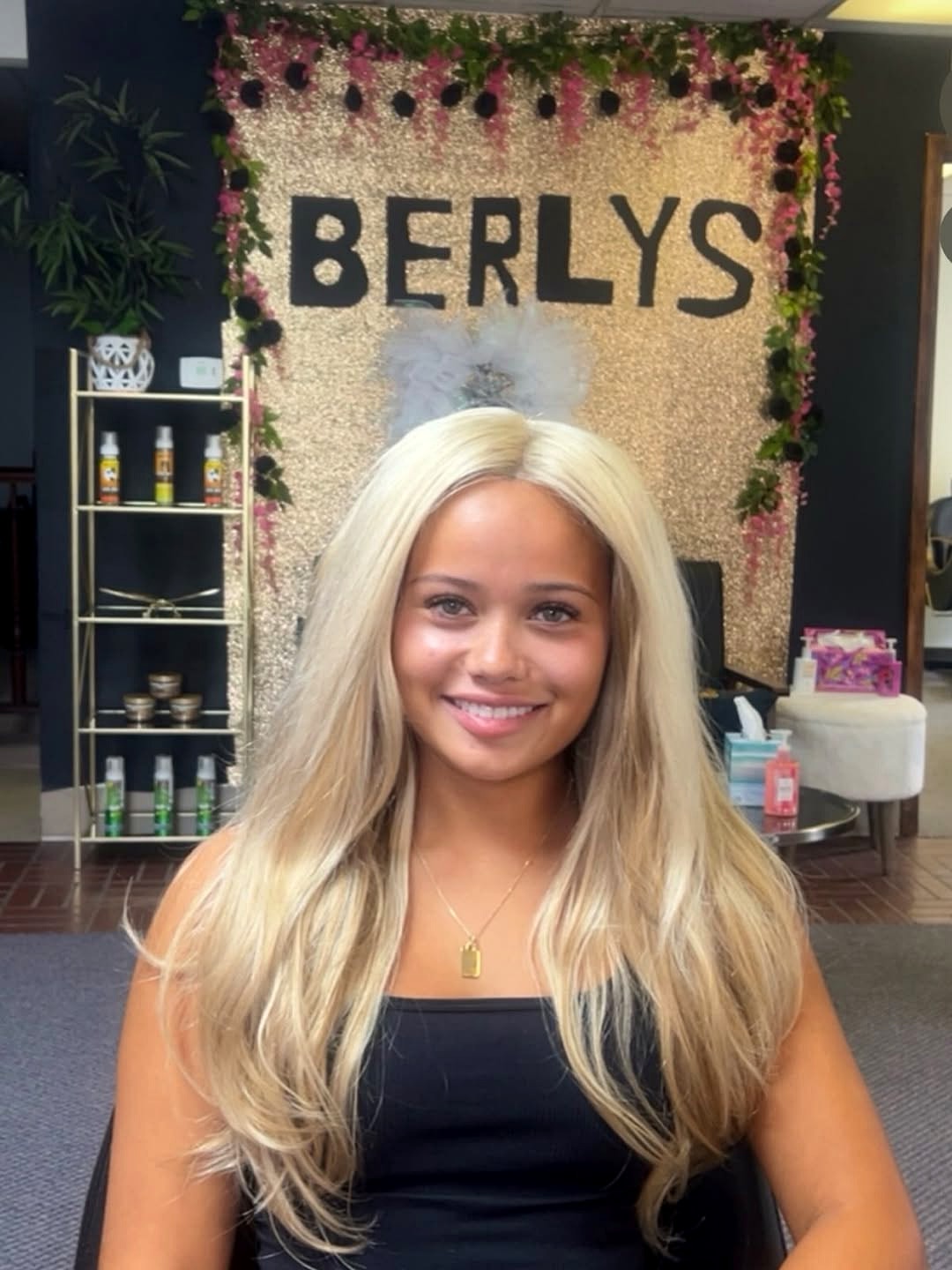 Blonde sew-in in front of the BERLYS gold backdrop at Berly's salon, McKeesport PA