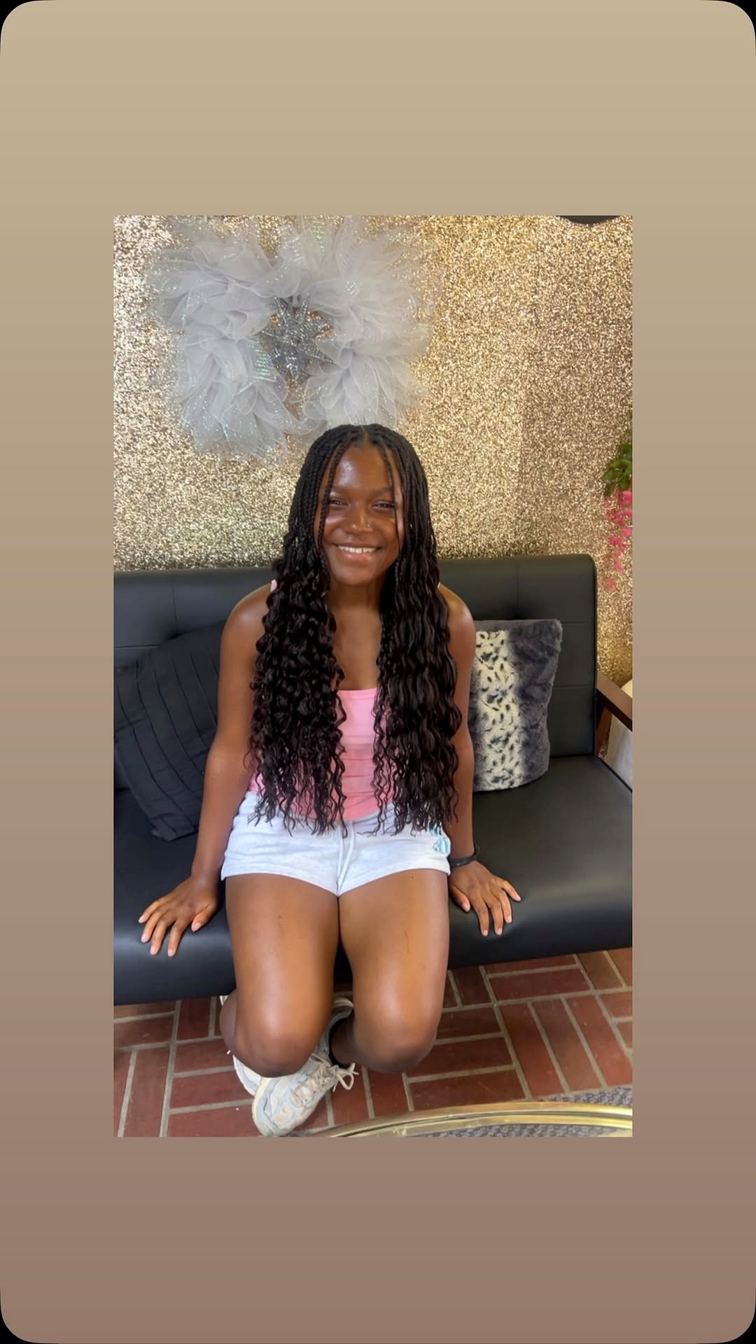 Boho wavy braids on the gold salon couch at Berly's in McKeesport, Pennsylvania