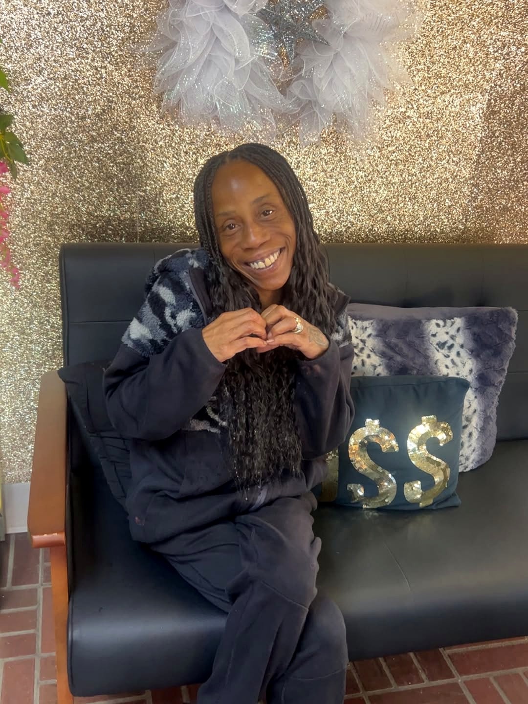 Client with finished braids smiling at Berly's Multi Culture Hair Braiding, McKeesport PA